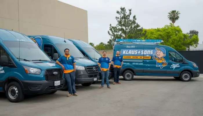 Klaus 2 KLaus and Sons technciains posed with trucks