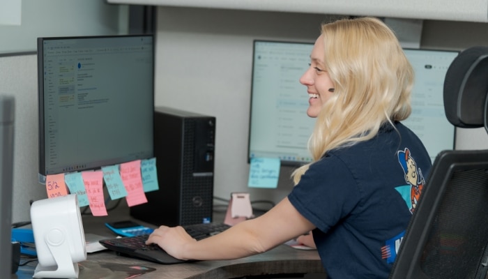 Customer Service Represenative In Office Answering Phone